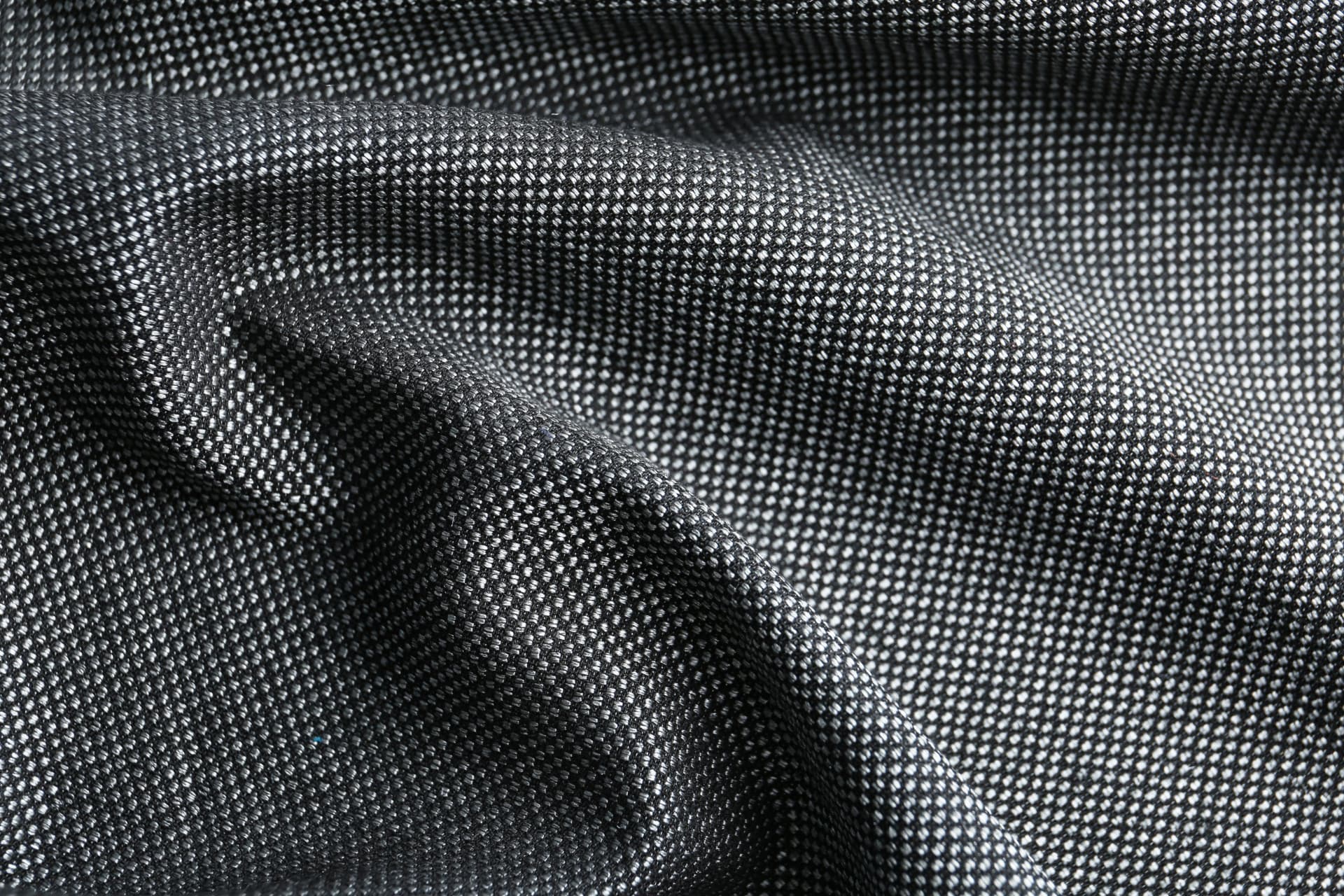 Dettaglio di tessuto sartoriale in lana a microdisegno